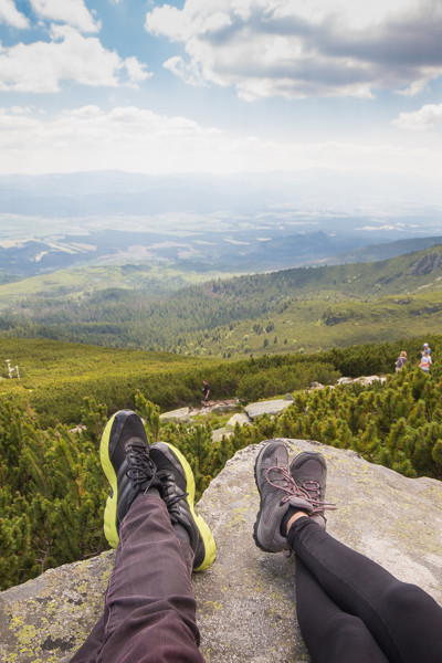 couples feet on mountain